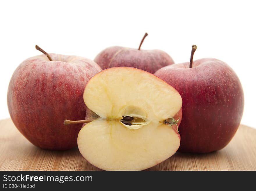 Halved apple on edge board