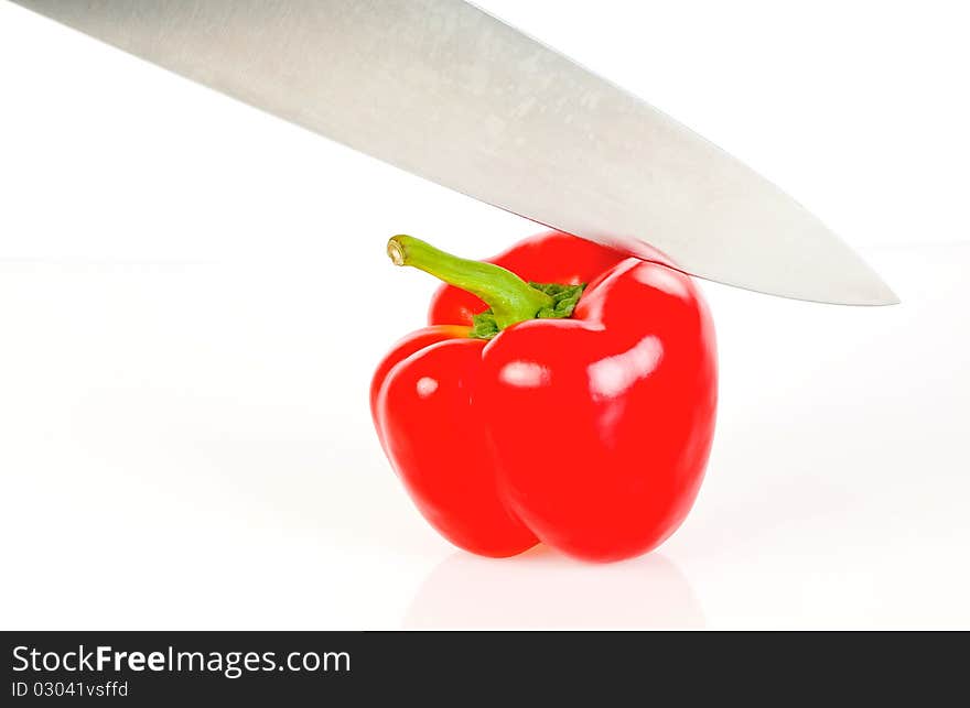 Paprika and knife isolated on white background. Paprika and knife isolated on white background