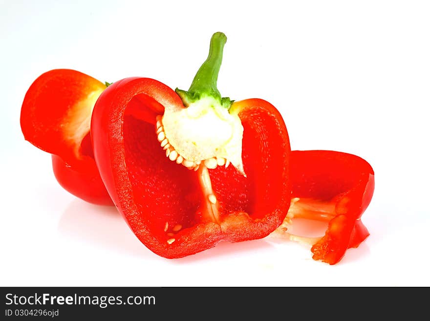 Sliced red paprika isolated on white background