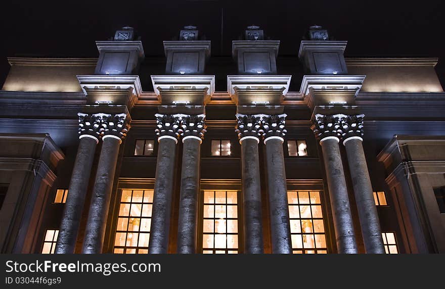 Stalin's classical architecture. Columns with capitals. Night view.