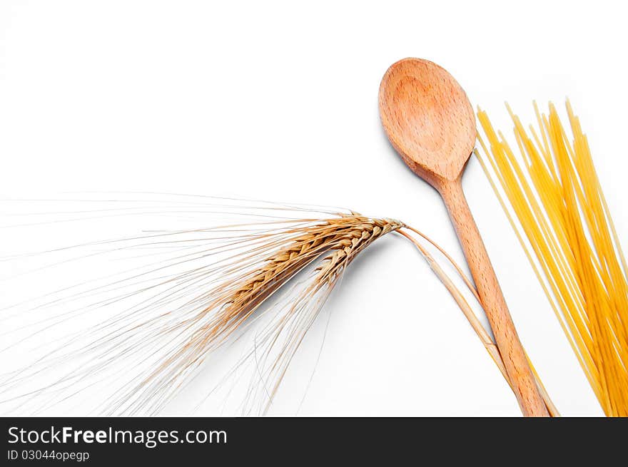 Ear of wheat, pasta and wooden spoon