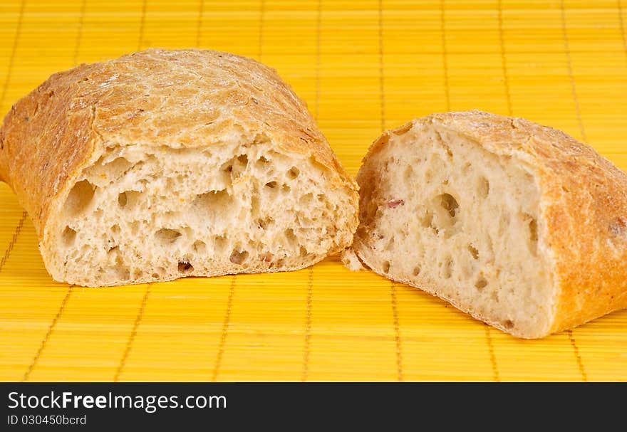 Fresh bread on yelloy background