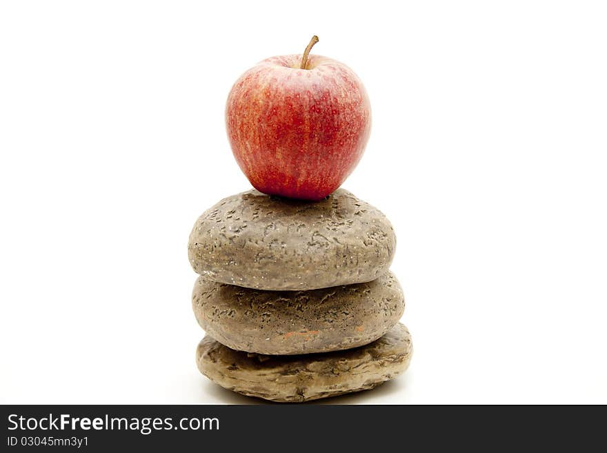 Apple onto stacked stones