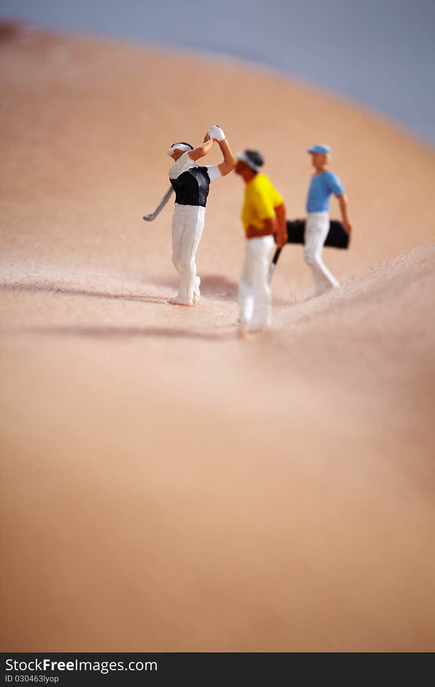 Miniature Figures playing golf