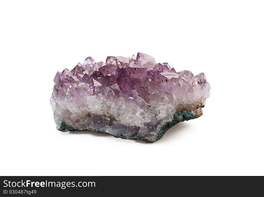 Crystals of amethyst are isolated on a white background