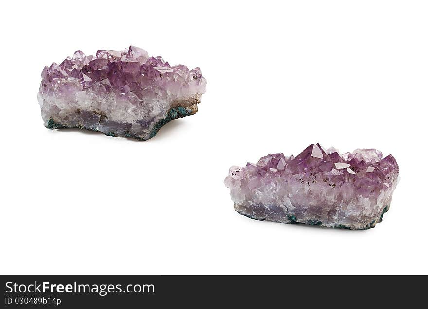 Crystals of amethyst are isolated on a white background