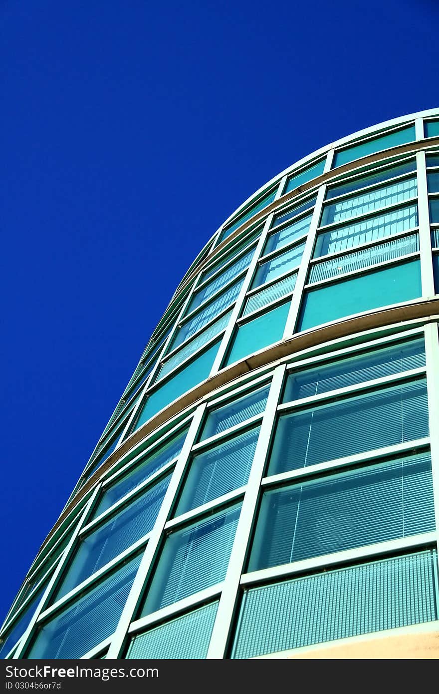 Image of an office building on a sunny day. Image of an office building on a sunny day