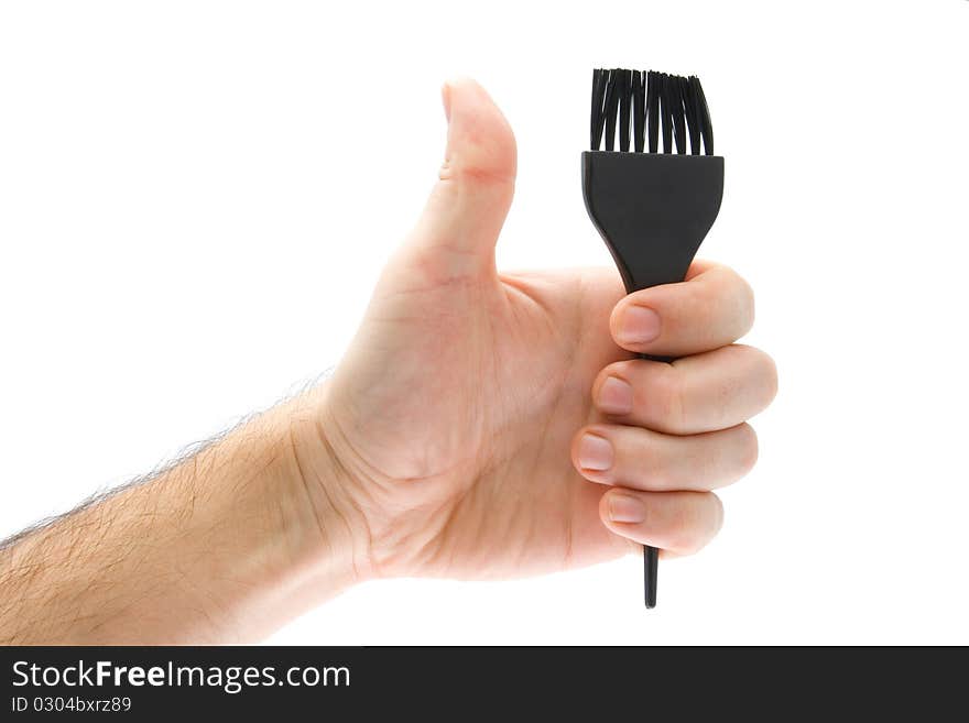 Brush in hand on white background