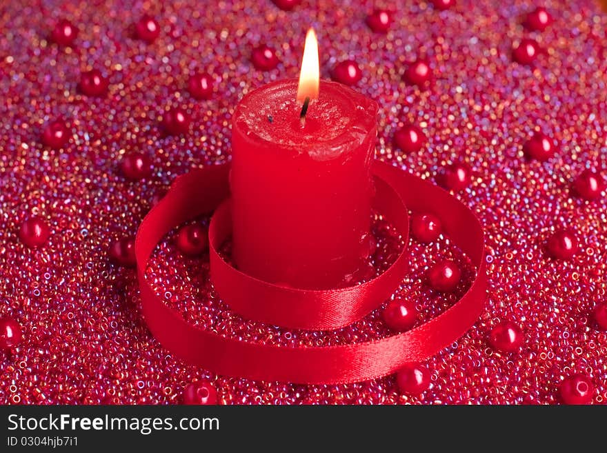 Burning Candle With Red Ribbon