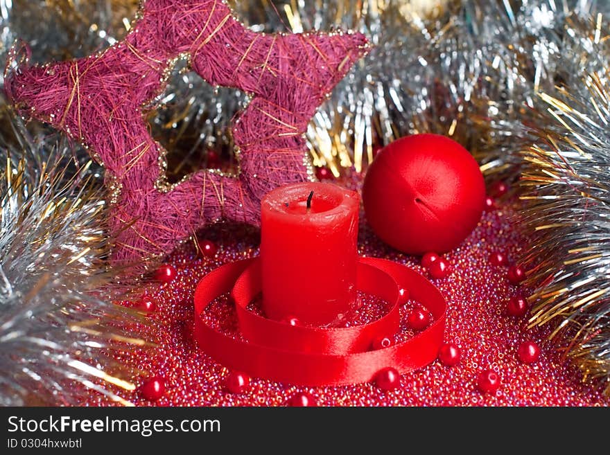 Extinguished candle with christmas decorations