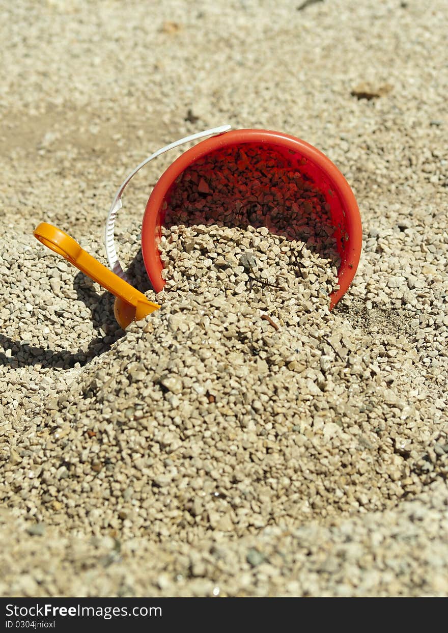 Bucket in the sand on the sea coast