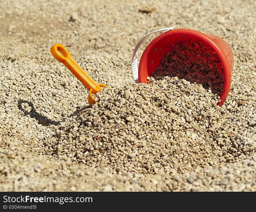 Bucket in the sand on the sea coast