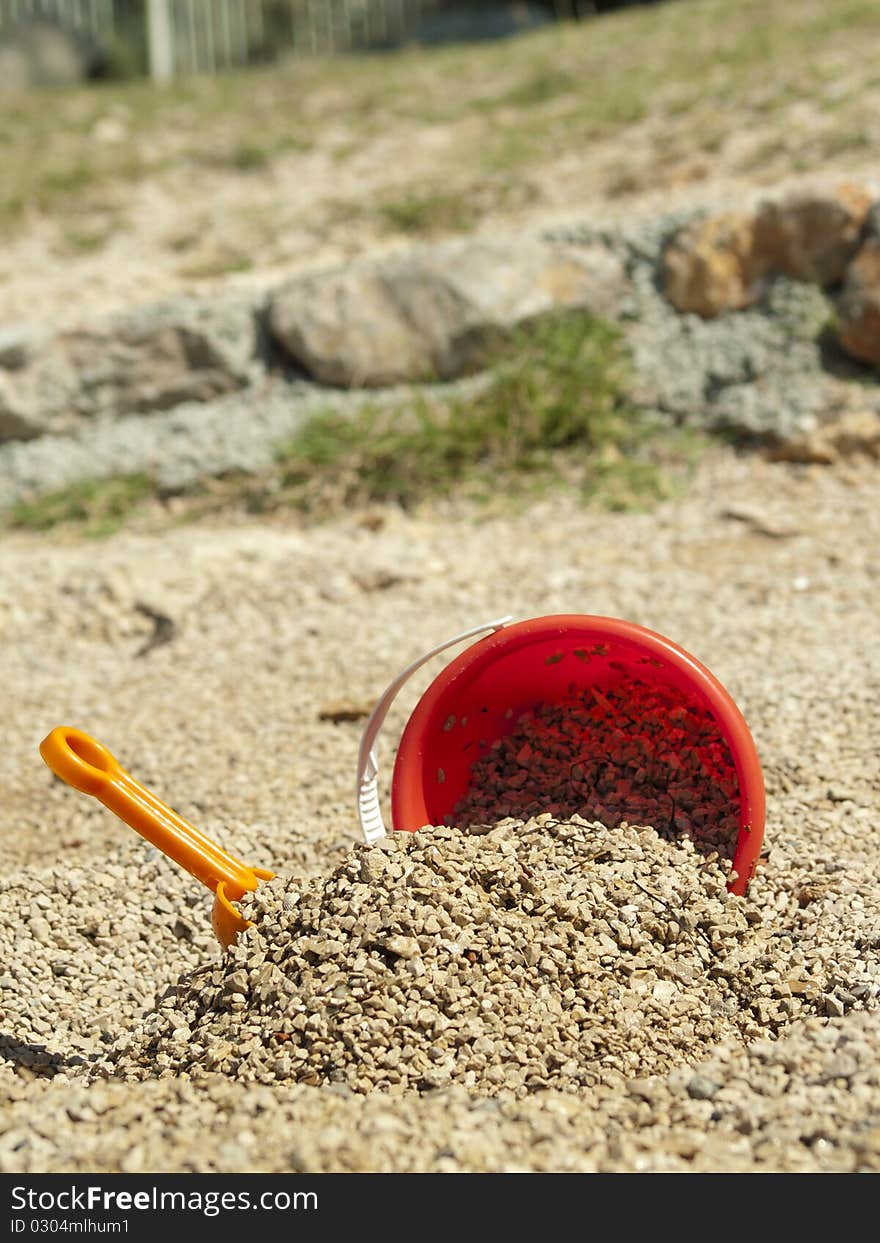 Bucket in the sand on the sea coast