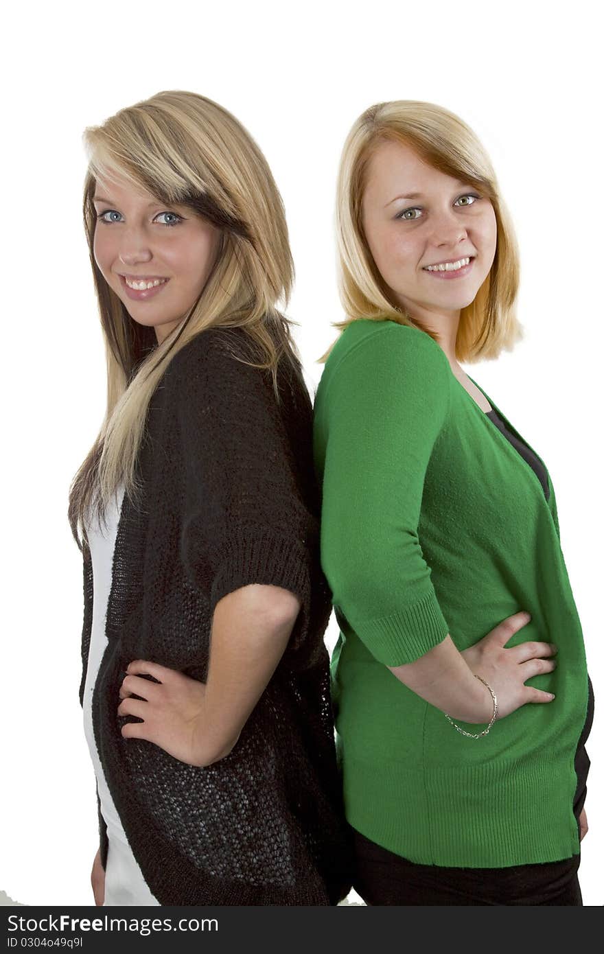 Two young caucasian girlfriends having fun together  isolated over white background. Two young caucasian girlfriends having fun together  isolated over white background