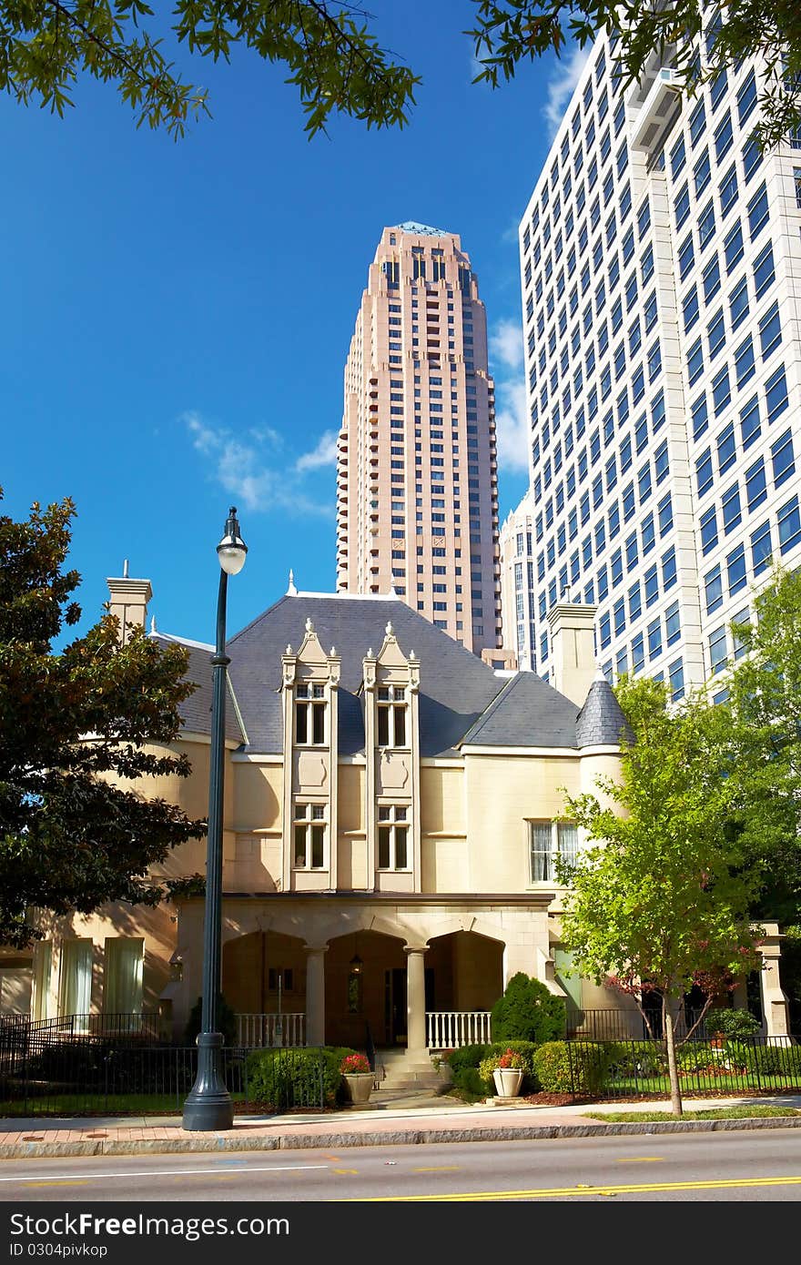 Old House Against The Skyscrapers