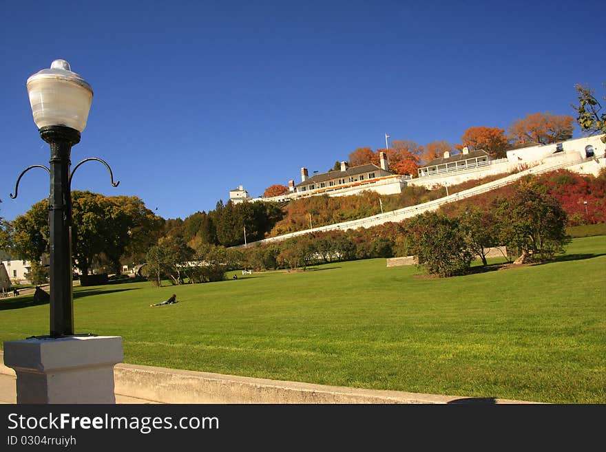 View of Fort Mackinac from the water front with green space in foreground