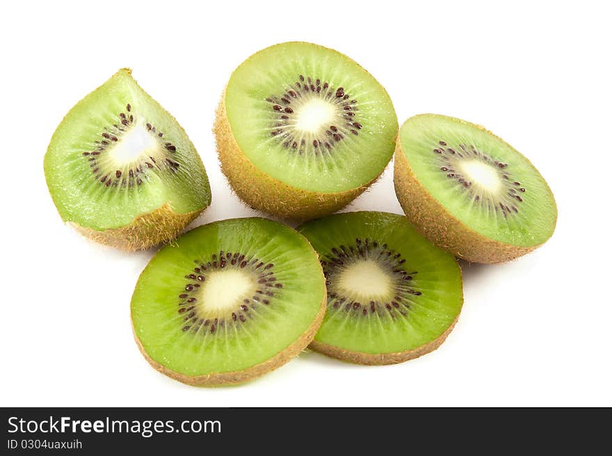 Kiwis, whole and slices on a white background. Kiwis, whole and slices on a white background