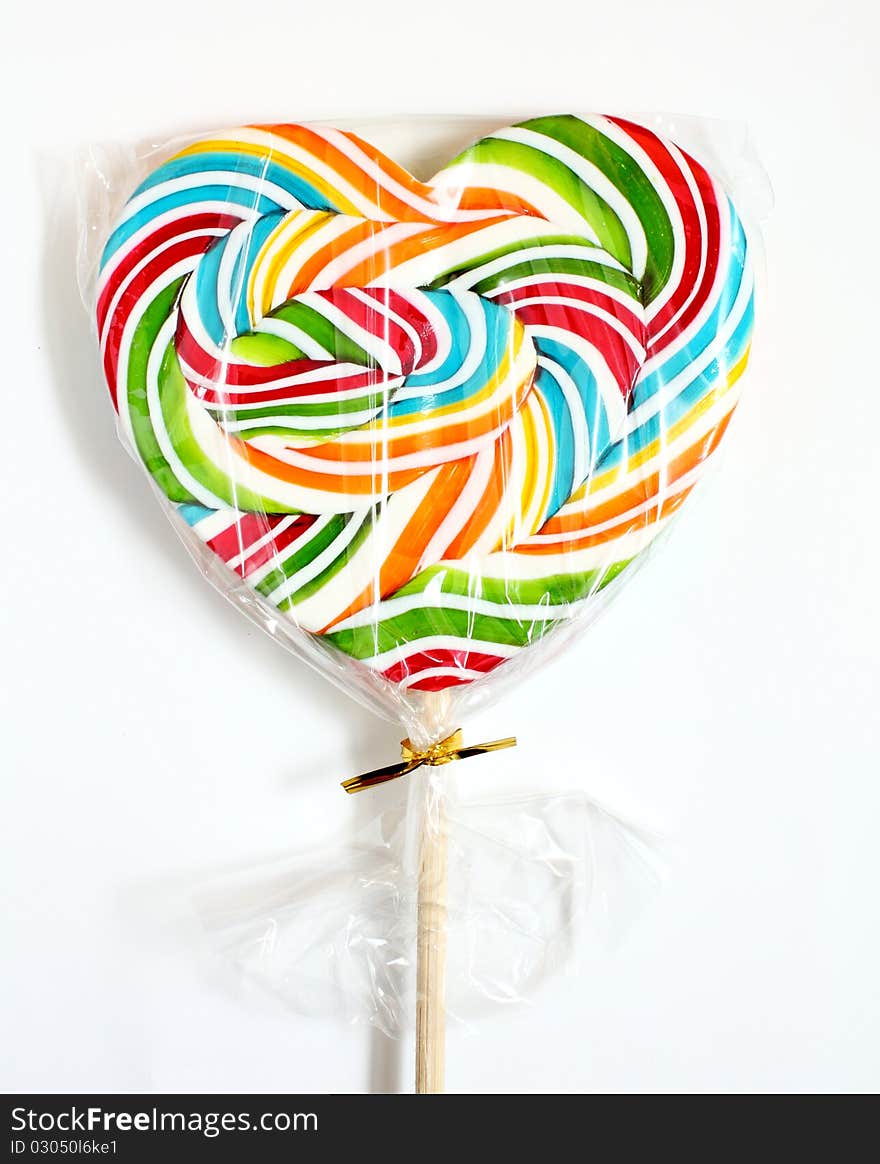 Close up of colourful lollipop, heart shape. Close up of colourful lollipop, heart shape.