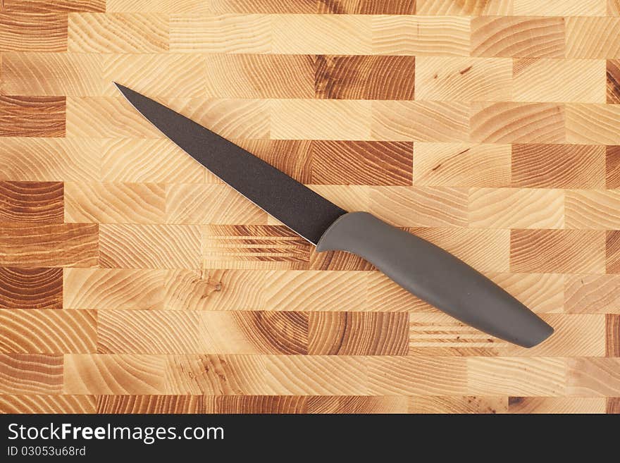 Kitchen knifes isolated on wooden background