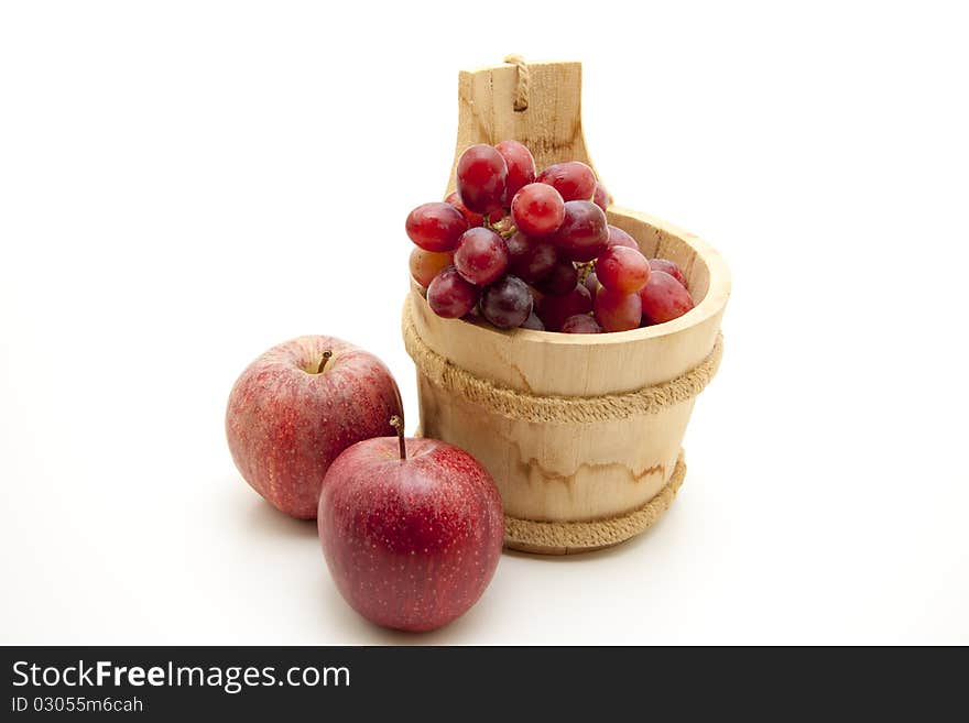 Red grapes in the wood receptacle. Red grapes in the wood receptacle