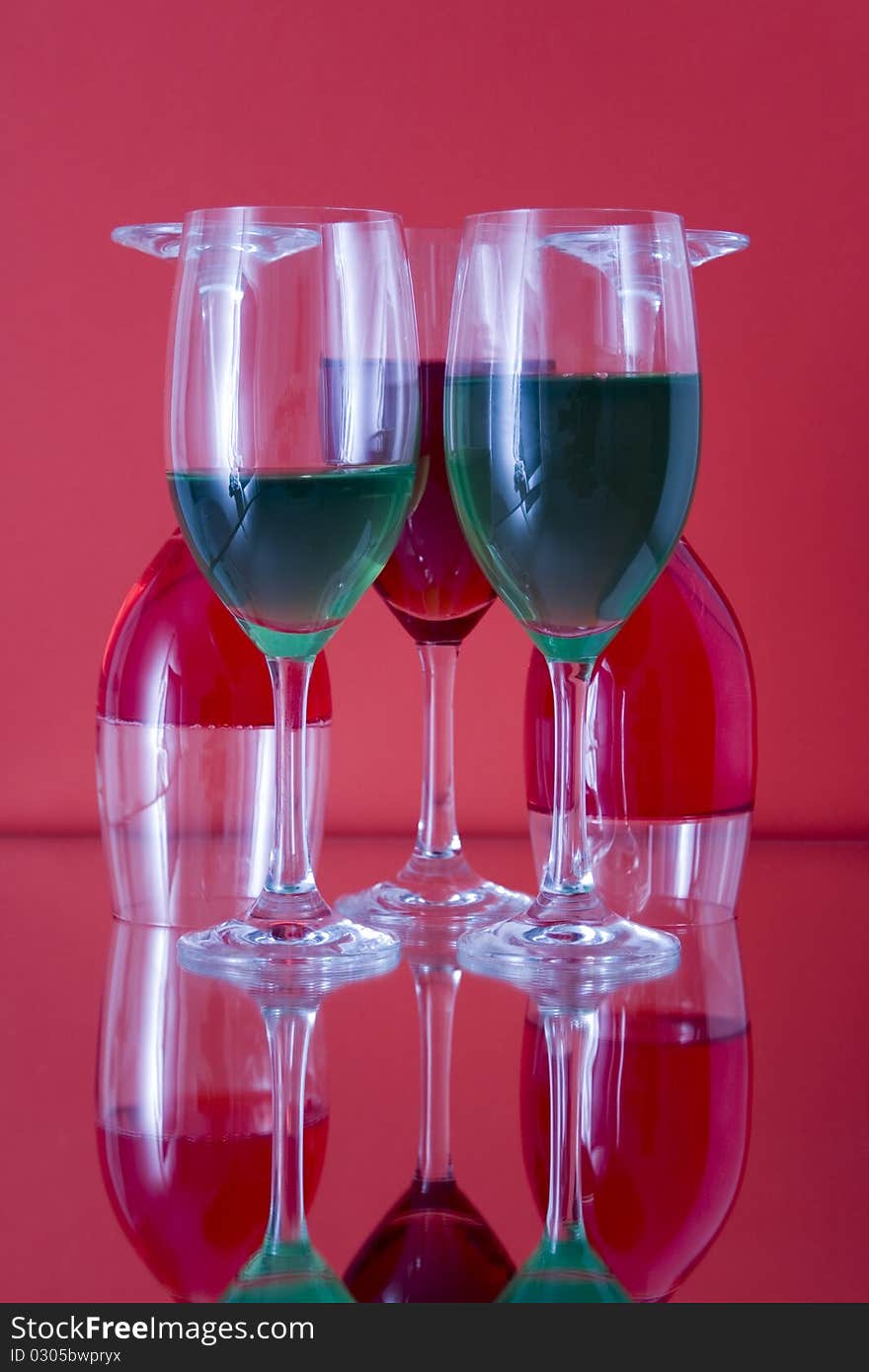 Colored glasses arranged on a glass substrate. Mirror was used as background