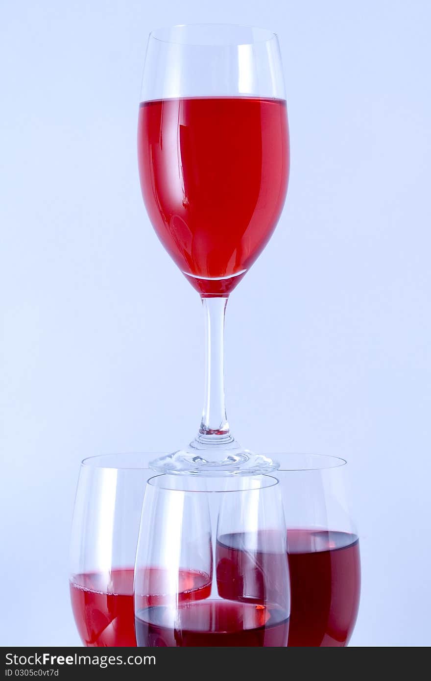 Glass arranged on a glass substrate. Mirror was used as background. Glass arranged on a glass substrate. Mirror was used as background