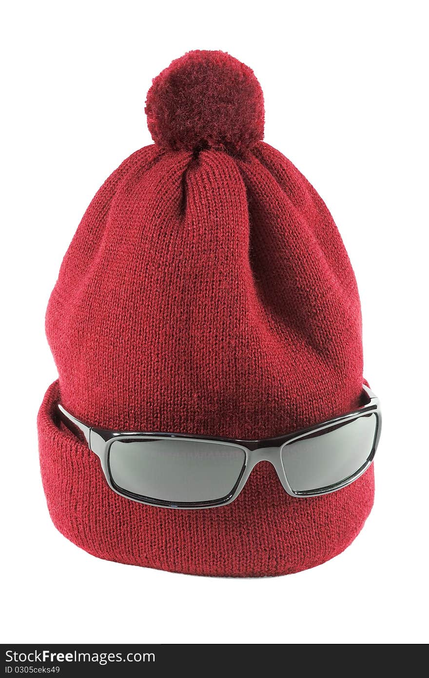 Wool Cap red with glasses on a white background. Wool Cap red with glasses on a white background