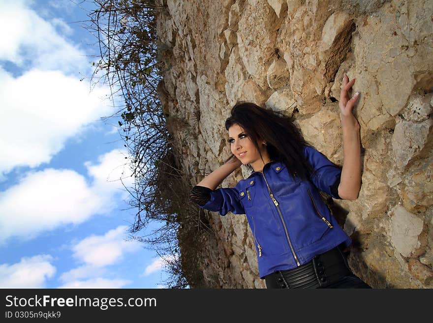 Portrait of young glamour girl with old wall background. Portrait of young glamour girl with old wall background