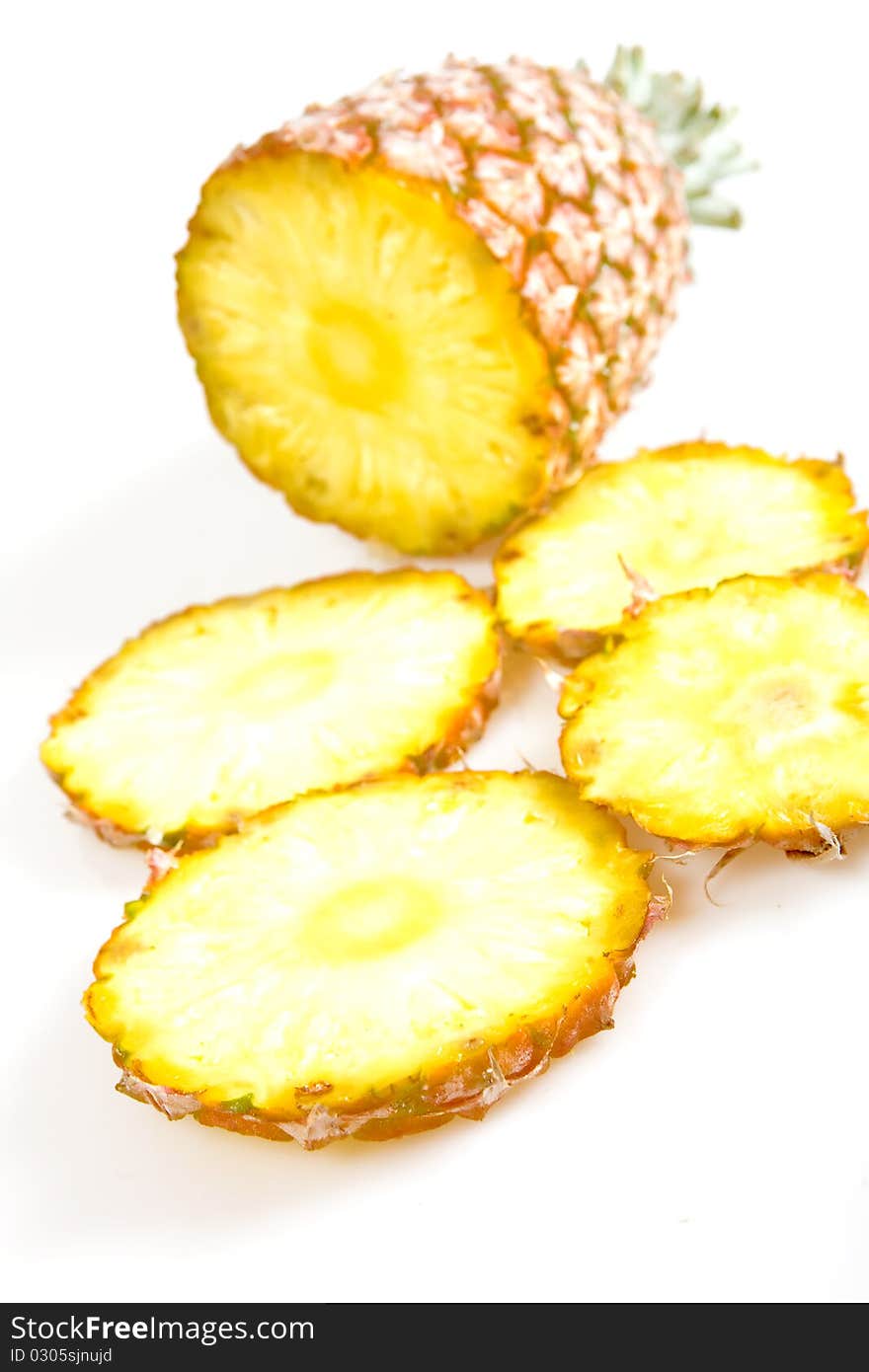 Cut pineapple isolated on white background