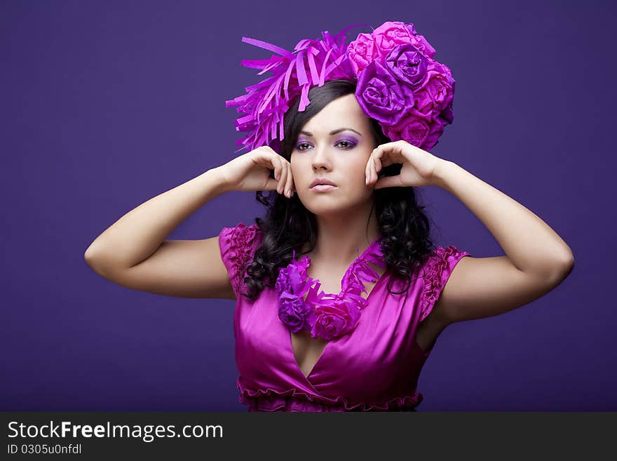 Beautiful girl in a hat with roses