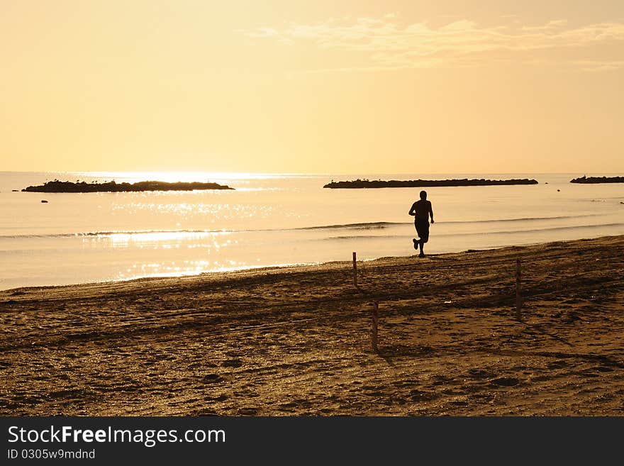 Man training on a beach