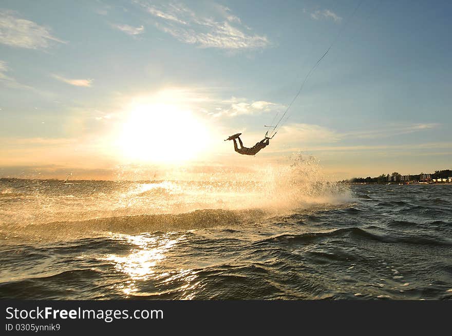 Kiteboarder Jumping On A Wave