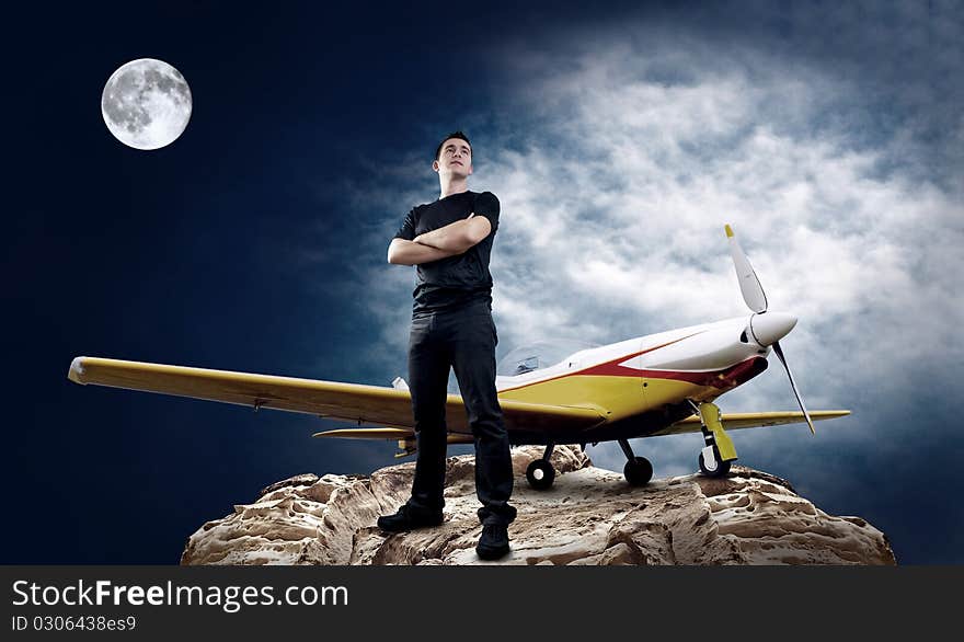 Man on the top of mountain and airplane at moon night. Man on the top of mountain and airplane at moon night