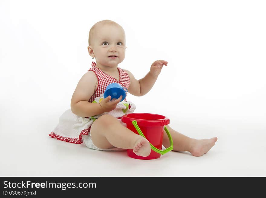 Infant with pail and pie, on white background. Infant with pail and pie, on white background.