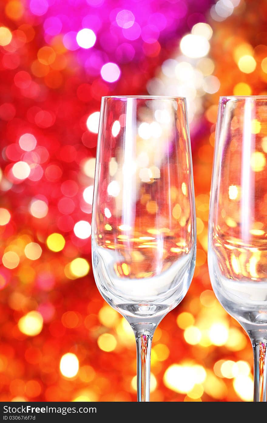 Two empty glasses for champagne on the blurred background. Two empty glasses for champagne on the blurred background