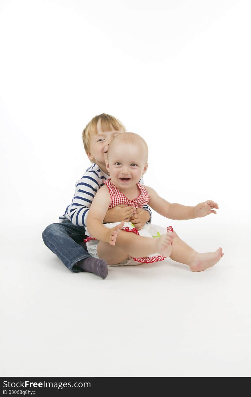 Boy and his sister, on white background. Boy and his sister, on white background.