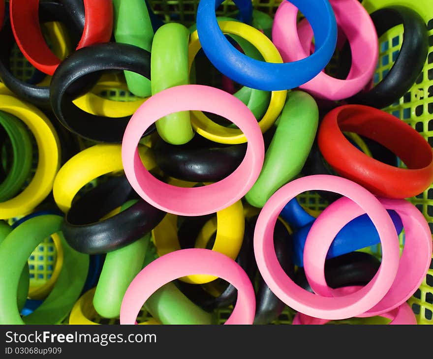 Trendy colorful wooden bracelets closeup