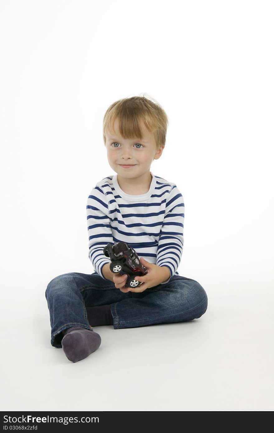 Boy with toy - car, on white background.