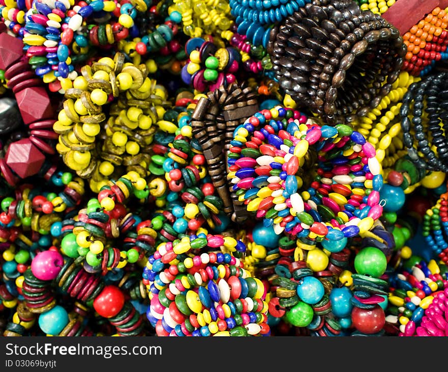 Trendy colorful wooden bracelets closeup