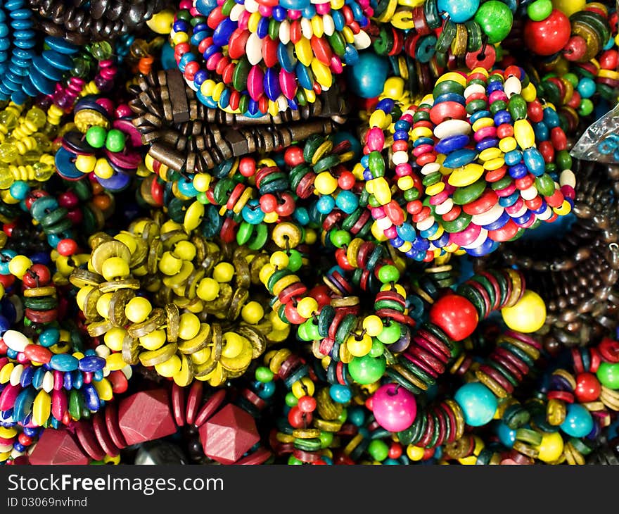 Trendy colorful wooden bracelets closeup