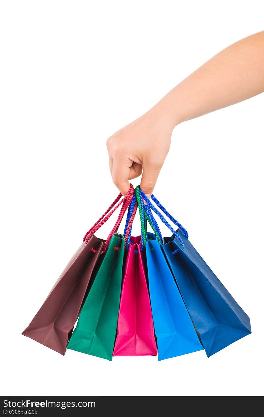 Hand with shopping bags isolated on white background