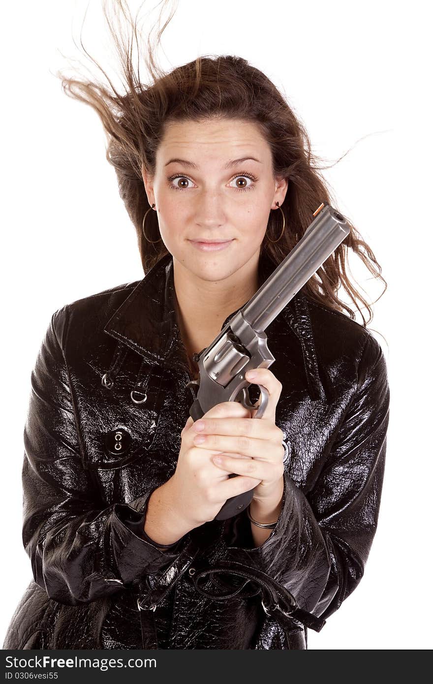 A woman is holding a gun looking excited. A woman is holding a gun looking excited.