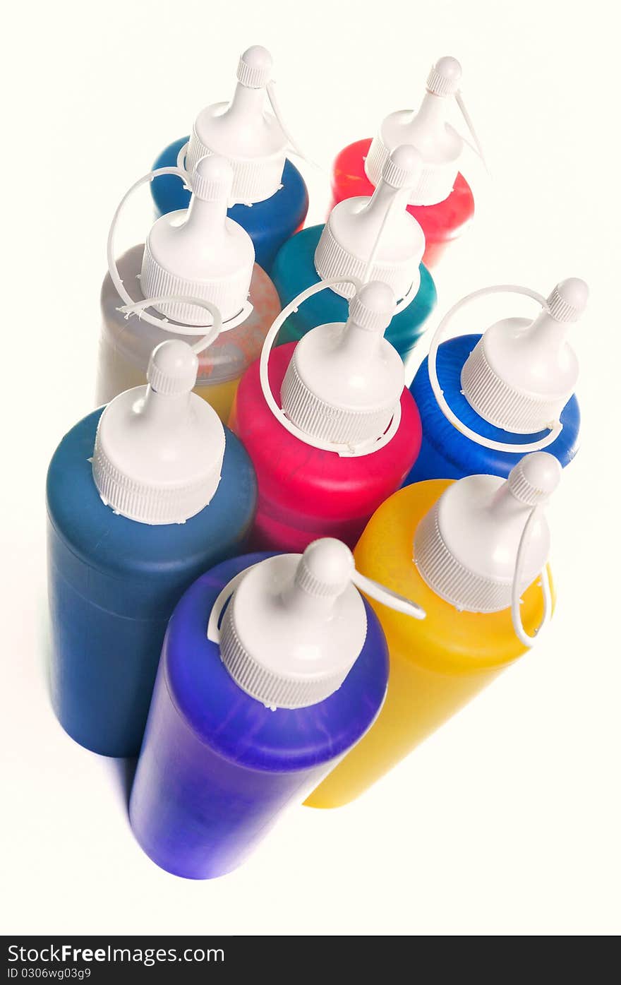 Group of color tubes over white background