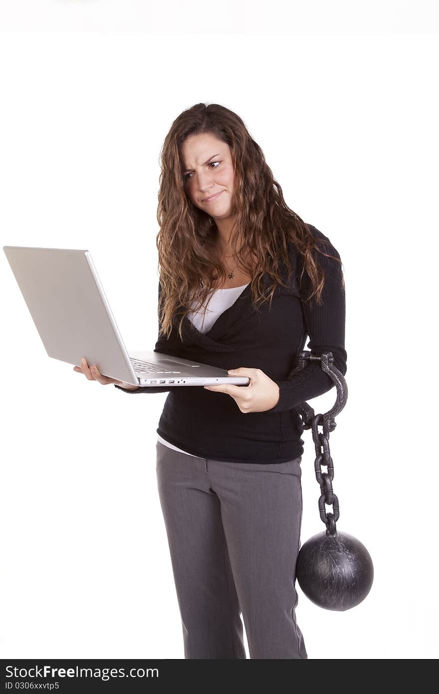 A woman is chained to her computer. A woman is chained to her computer.