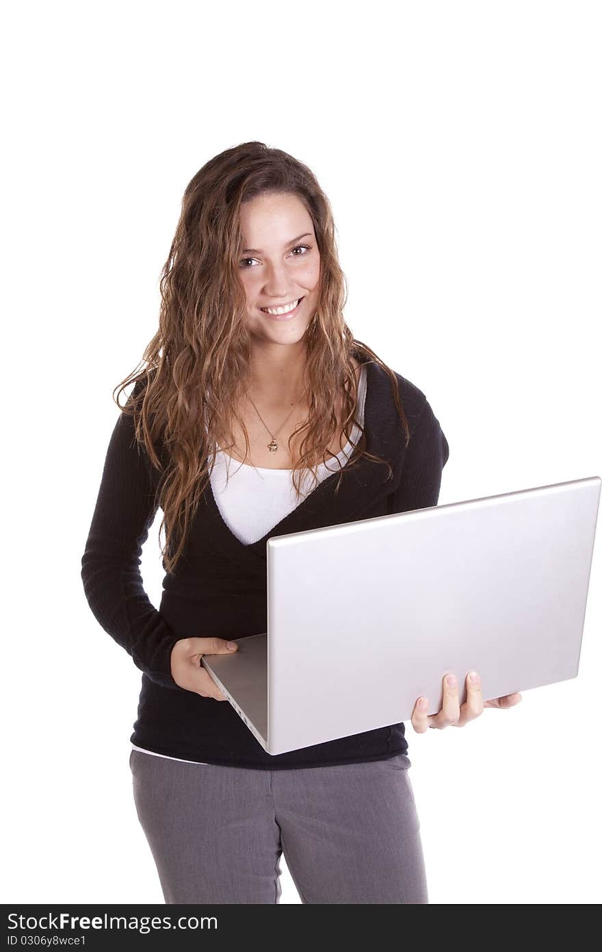 A business woman is holding a laptop computer. A business woman is holding a laptop computer.