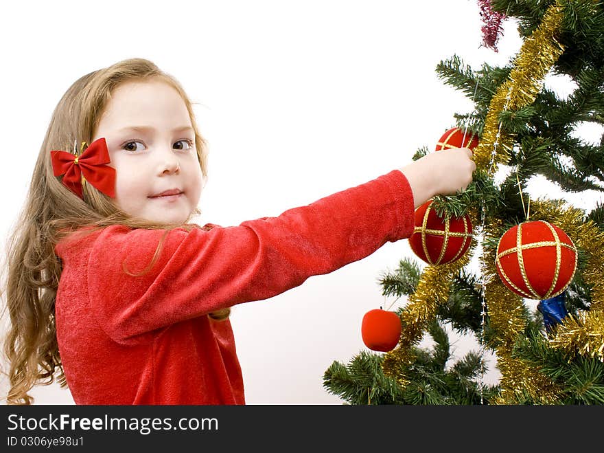 Little Girl decorating the christmas tree.. Isolated.