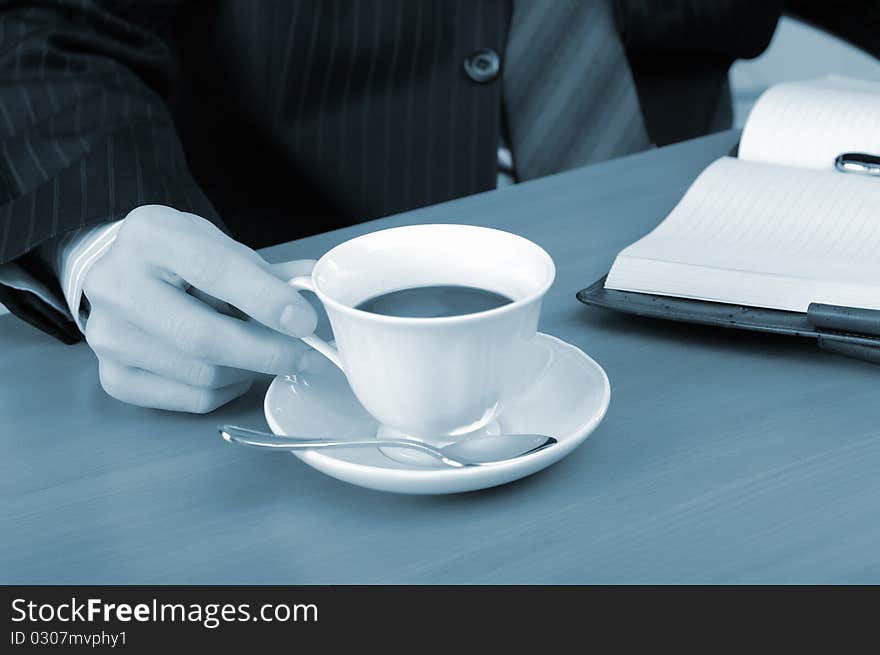 A young business man working in an office at his workplace.