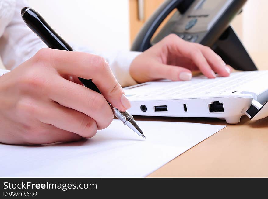 Young business woman working on the computer.