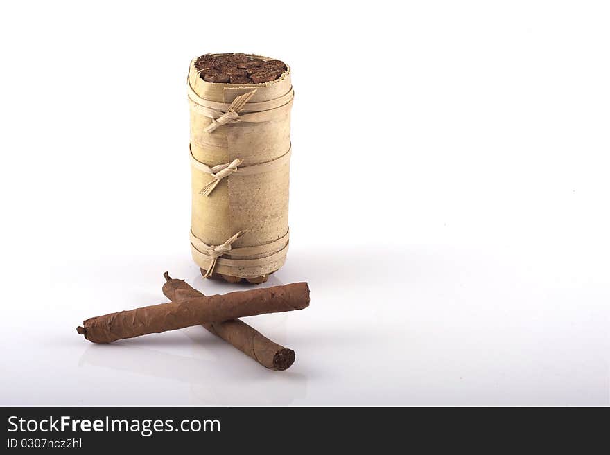 Two hand rolled cigars and a cuban humidor isolated on a white background