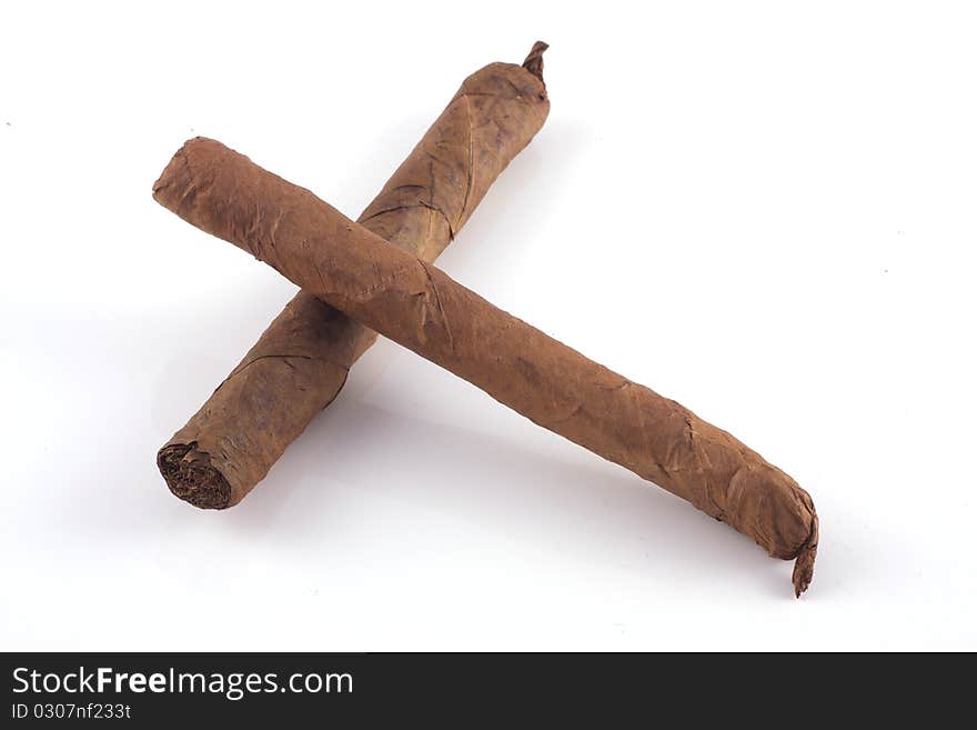 Two handrolled cigars and a cuban humidor isolated on a white background